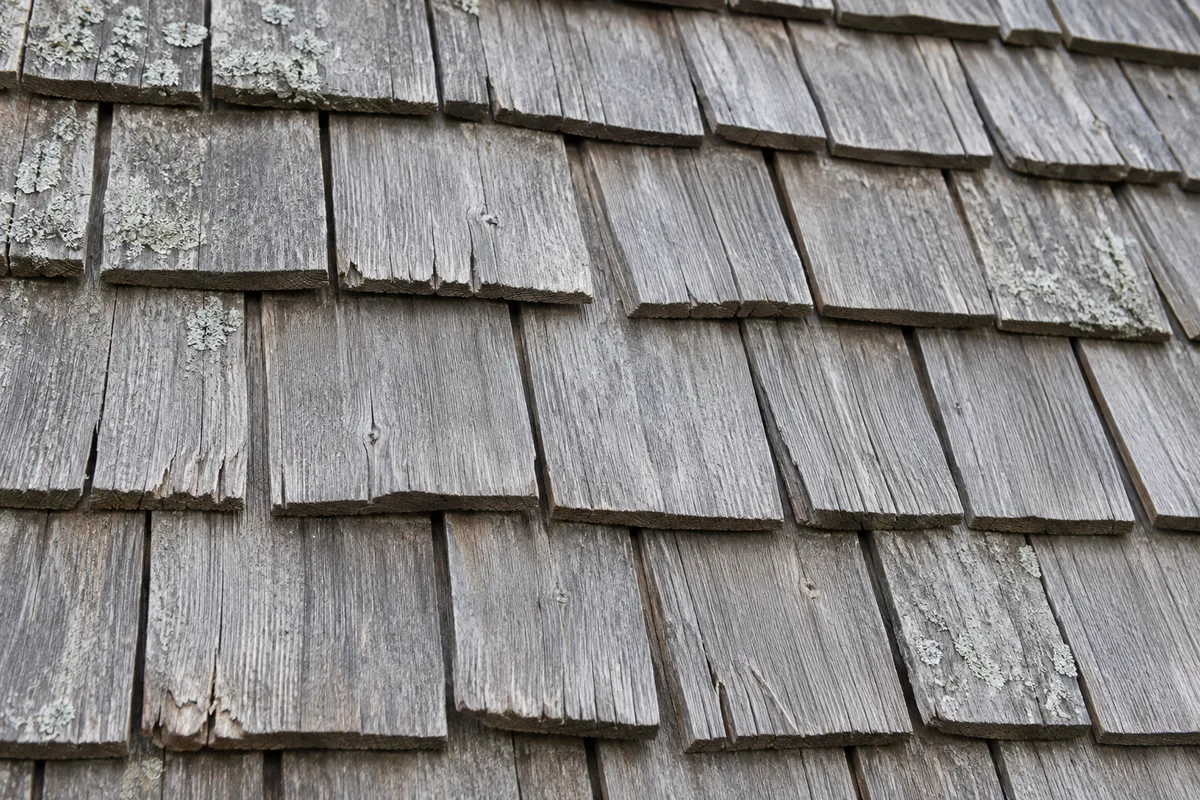 Close view of silvered cedar shingles and weathered wood grain